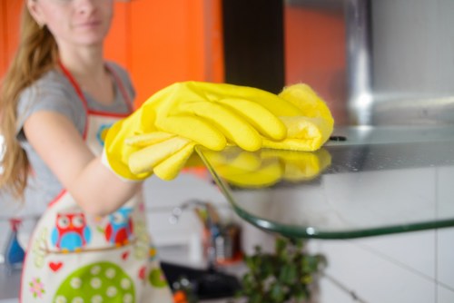 Clean kitchen surfaces as part of domestic cleaning